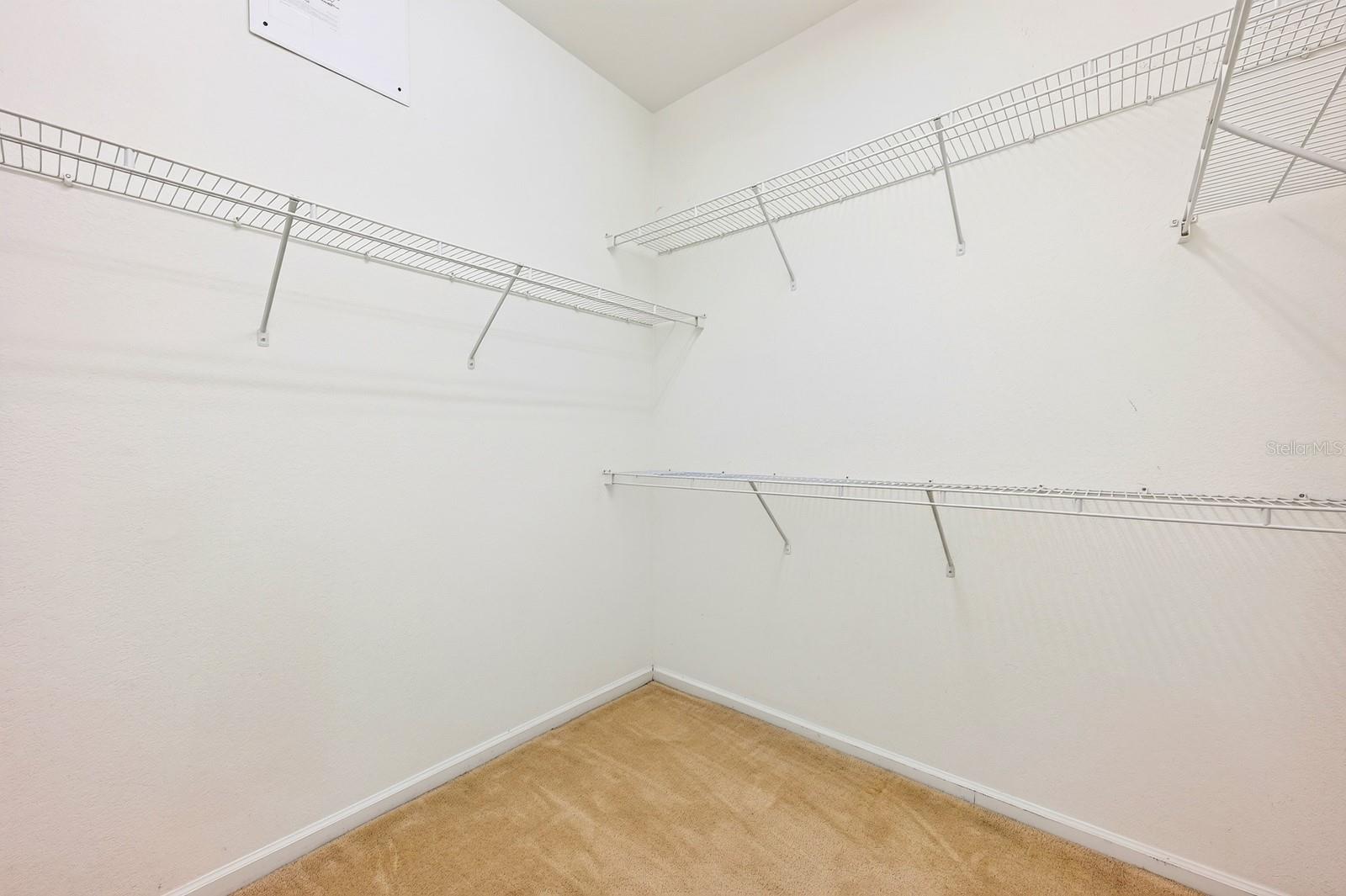 Primary suite walk-in closet.