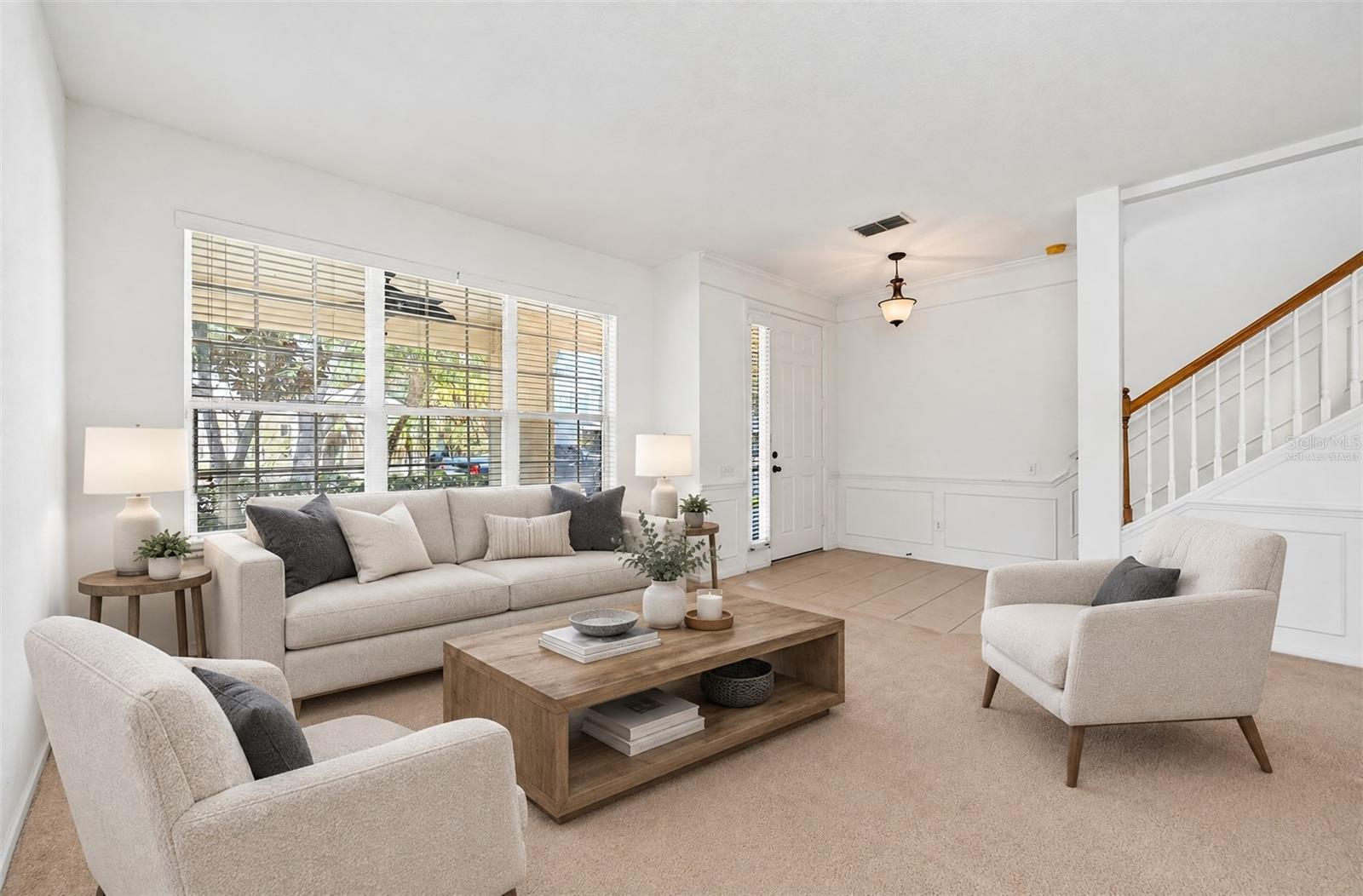 Formal living and dining spaces welcome you to come inside and make yourself at home. Virtually Staged.