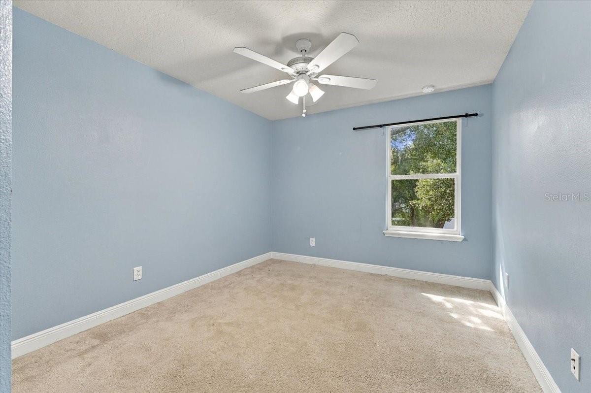 Secondary bedroom with double closet, easy access to the hallway