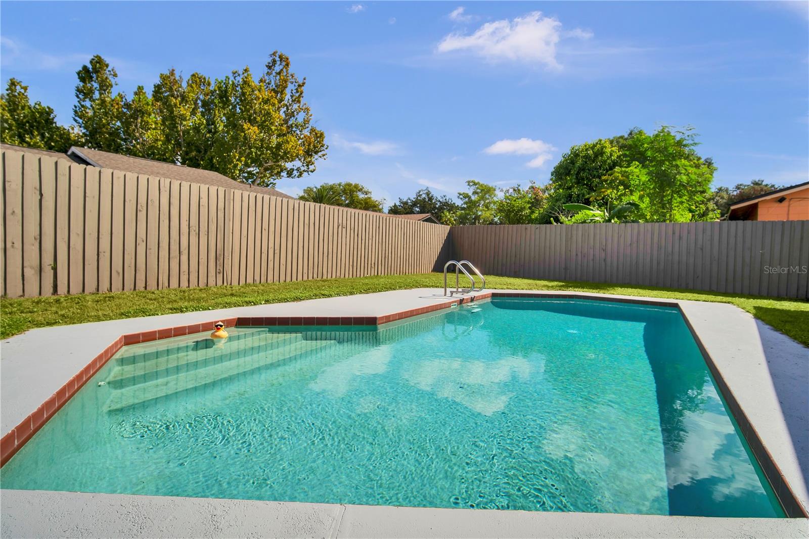 Enjoy Florida living with a fenced backyard and in-ground pool Enjoy Florida living with a fenced backyard and in-ground pool