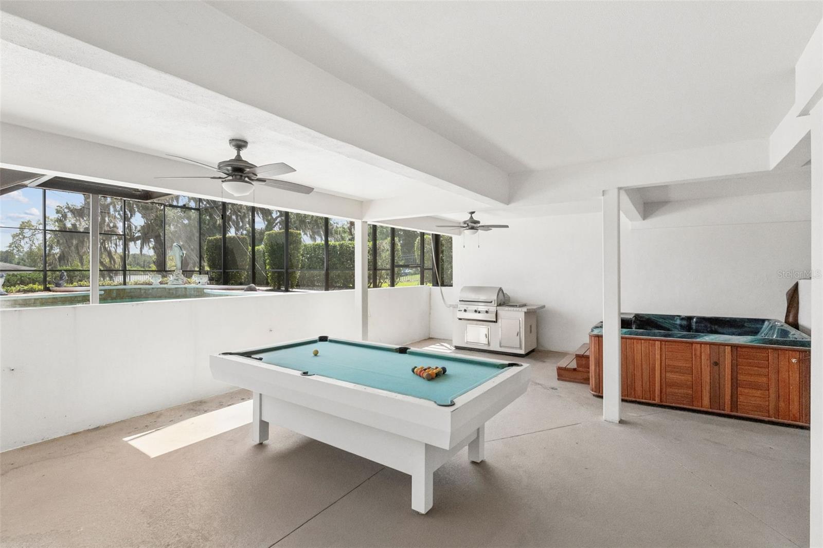 Covered lower-level entertainment area.