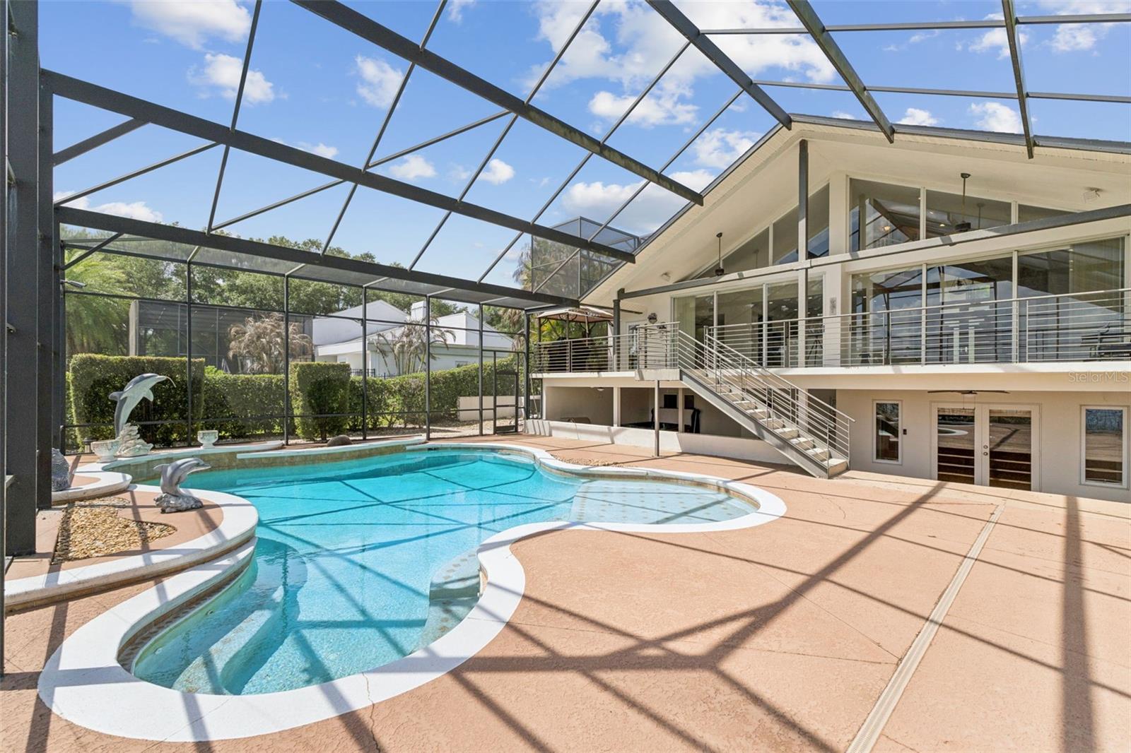 Screened pool, covered entertaining area.