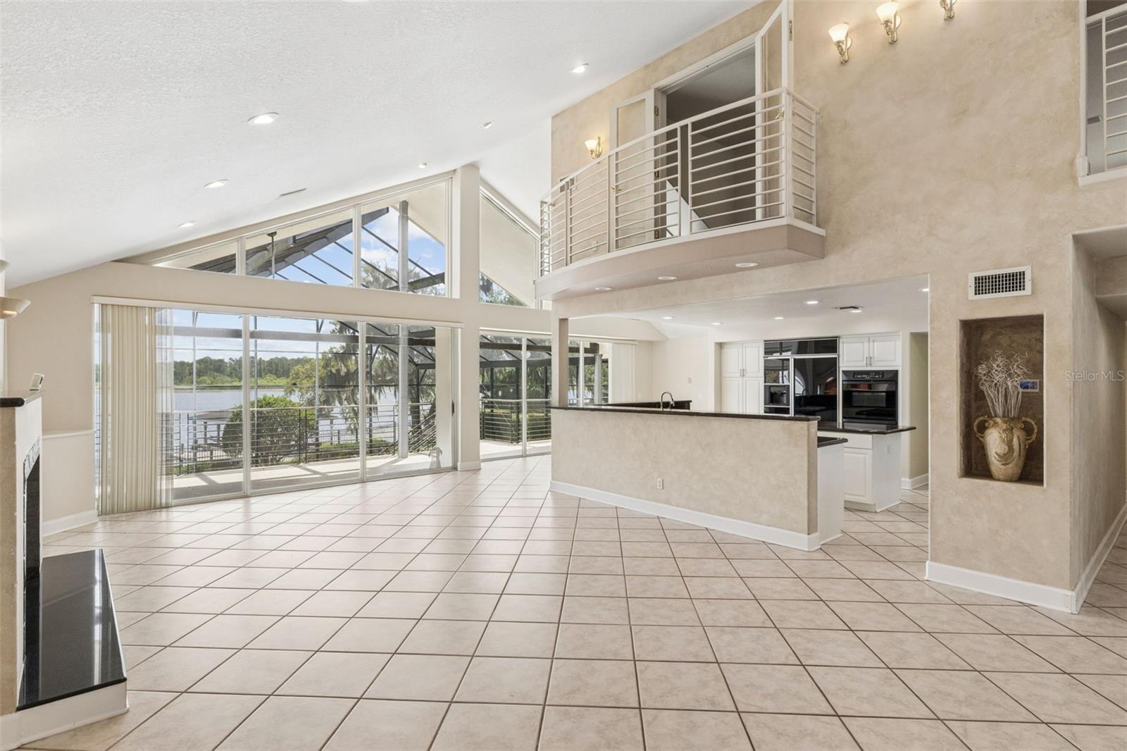 Living Room overlooking the kitchen, and office above Living Room overlooking the kitchen, and office above