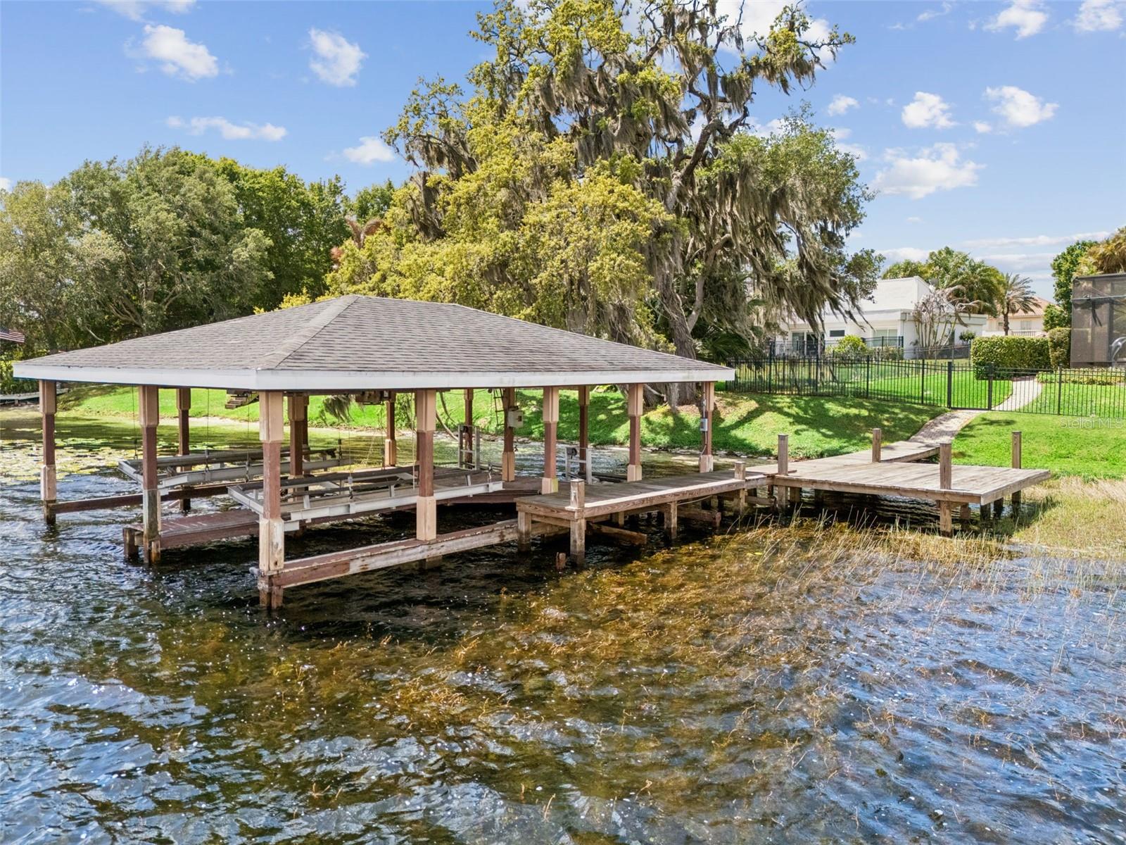 Private dock with space for two boats and two jet skis.