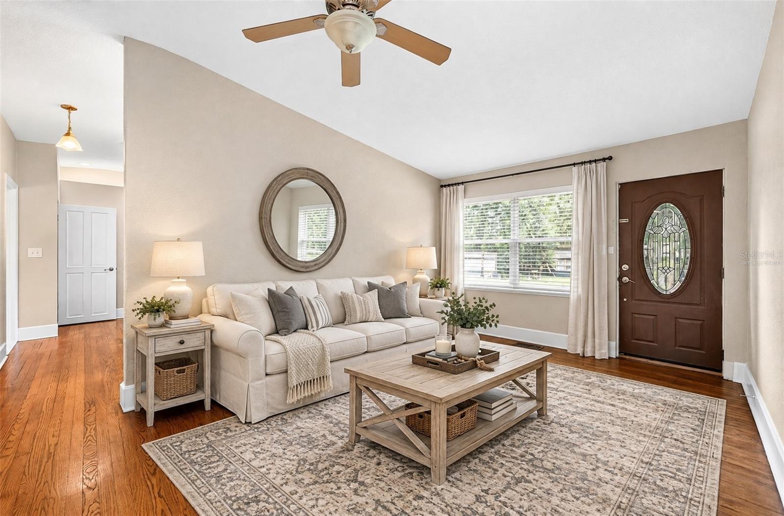 Formal living at the front of the home flows into the updated kitchen. Virtually Staged. Formal living at the front of the home flows into the updated kitchen. Virtually Staged.