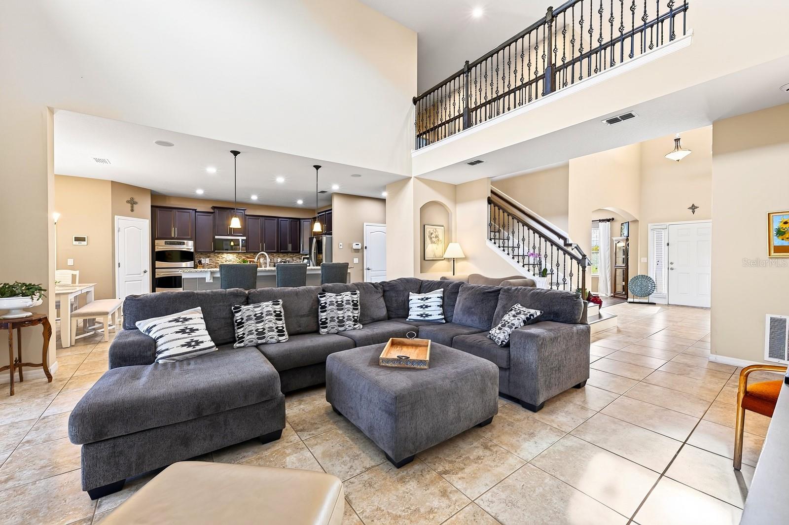 Natural light pours into the two story family room.