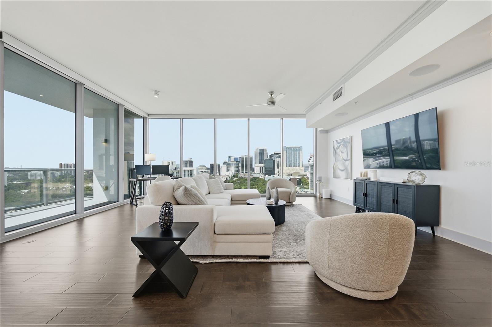 City view from kitchen overlooking living space. Dynamic layering of DTO buildings.