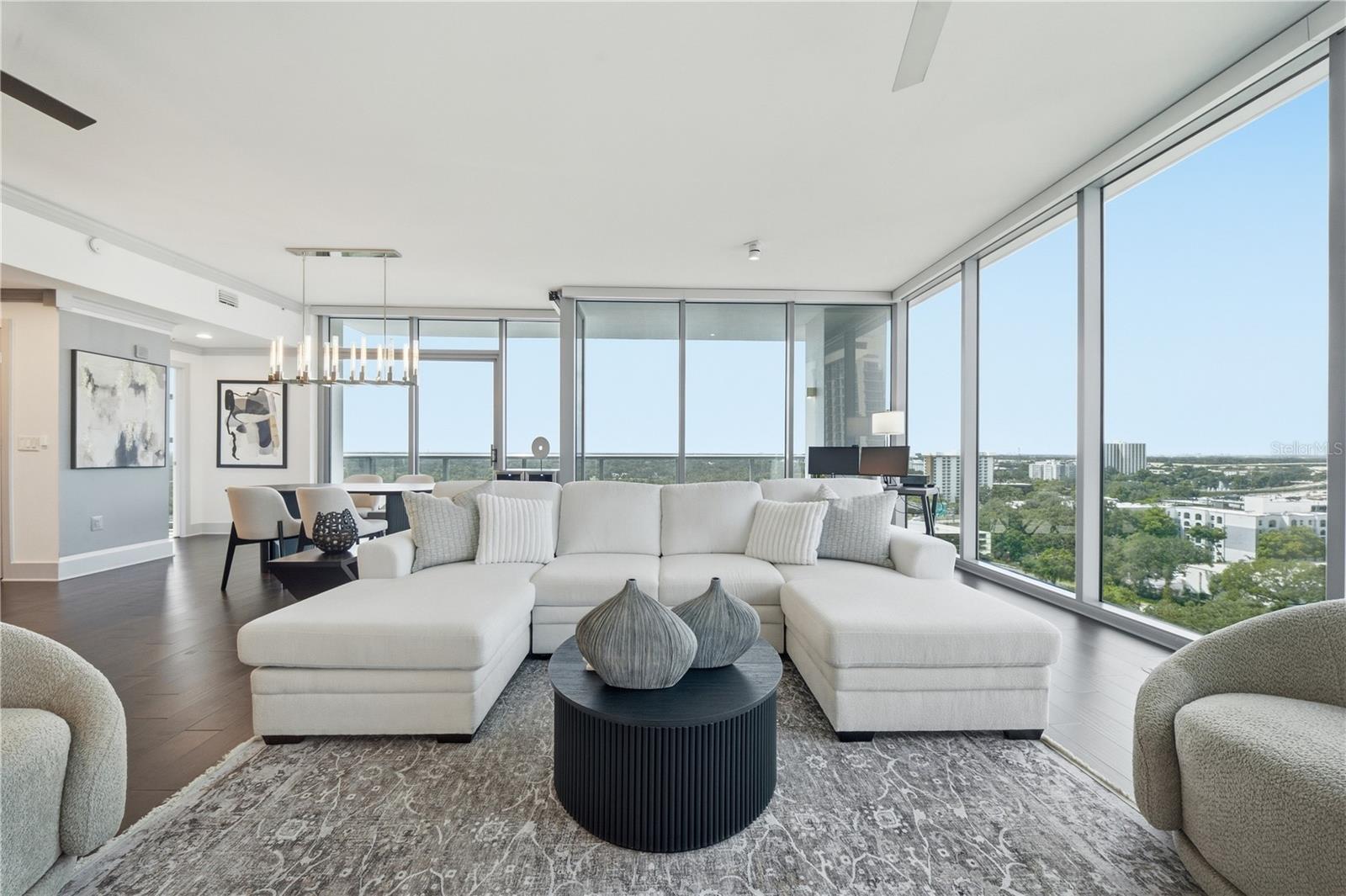 Living Room | Downtown Orlandos layered skyline becomes the backdrop to the main living space