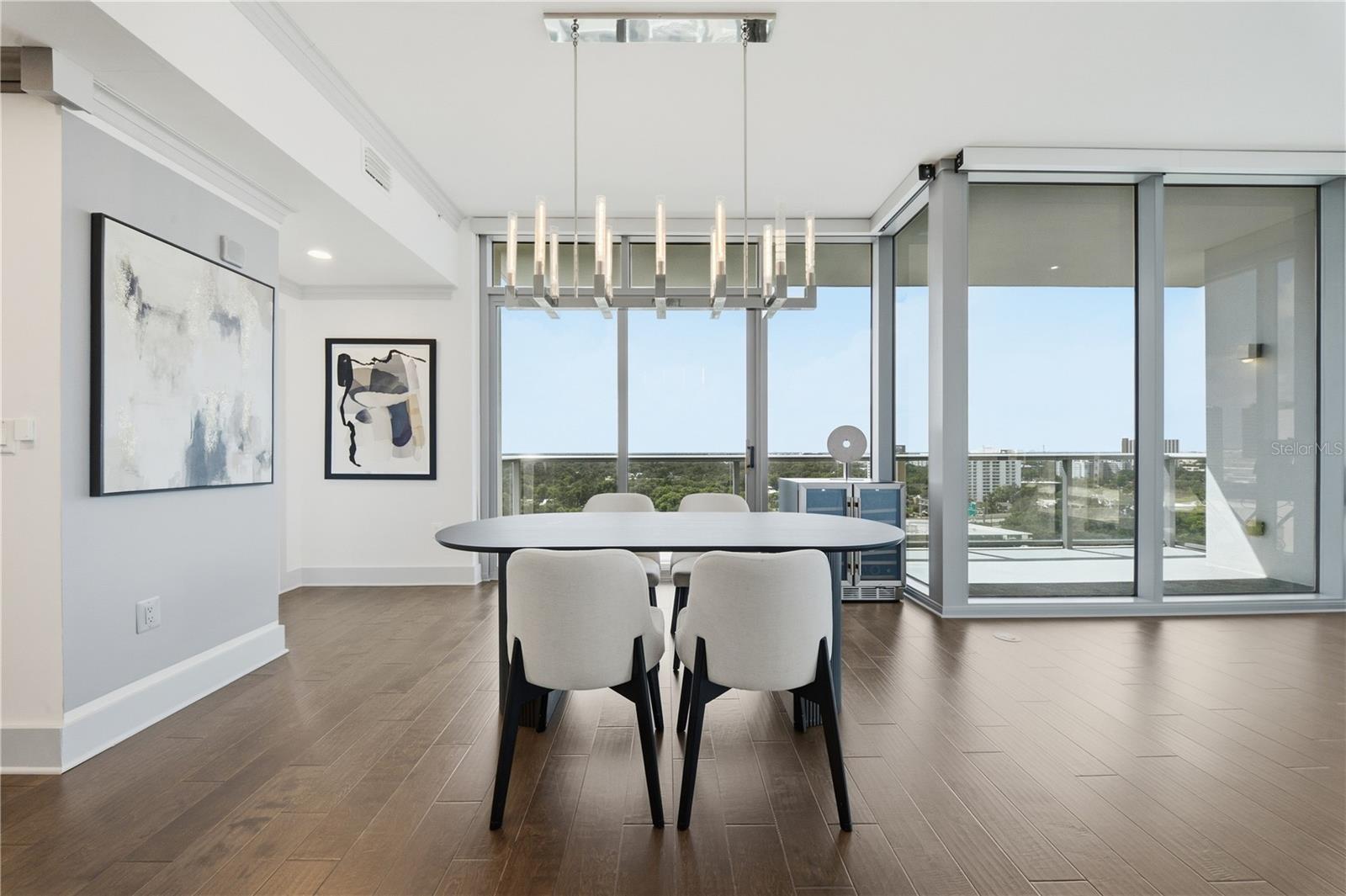 Dining + Kitchen | An open entertaining layout with the south-facing balcony just beyond