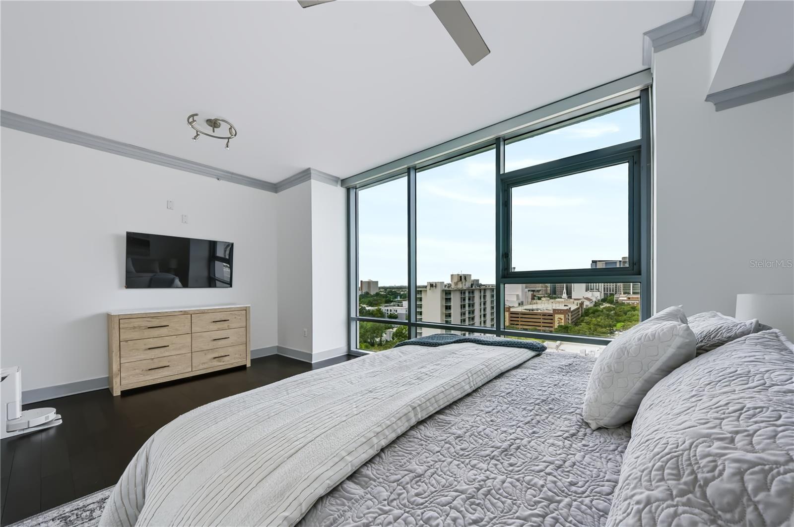 Primary bedroom, with en suite. City facing view.