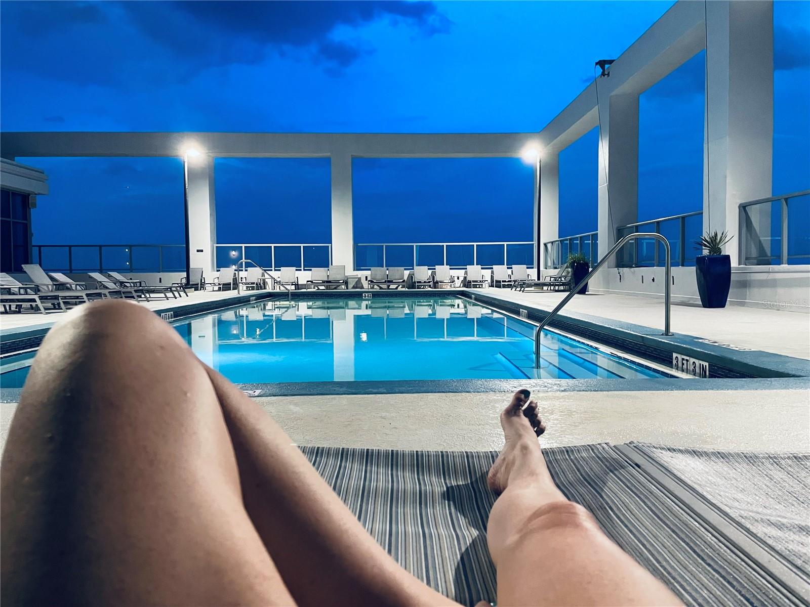 ROOFTOP POOL AT NIGHT.