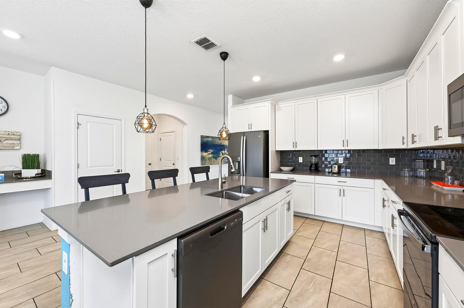 A generous center island offers extra prep space and room for counter-height seating.