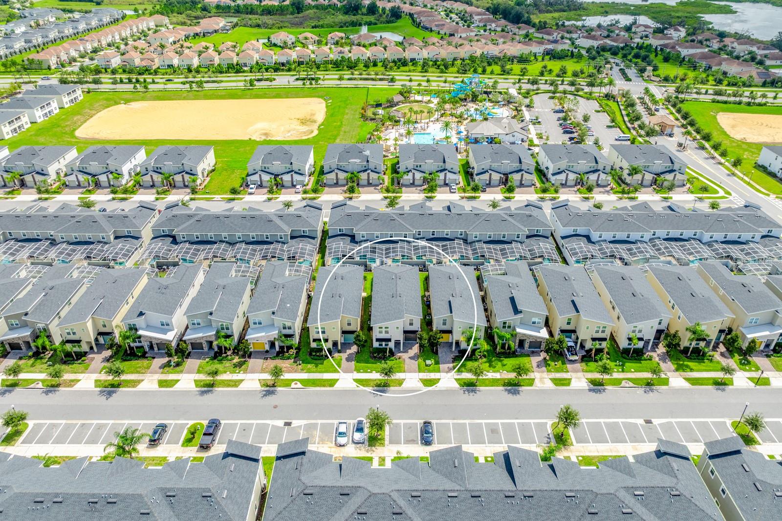 Aerial view of the front of the home and community.