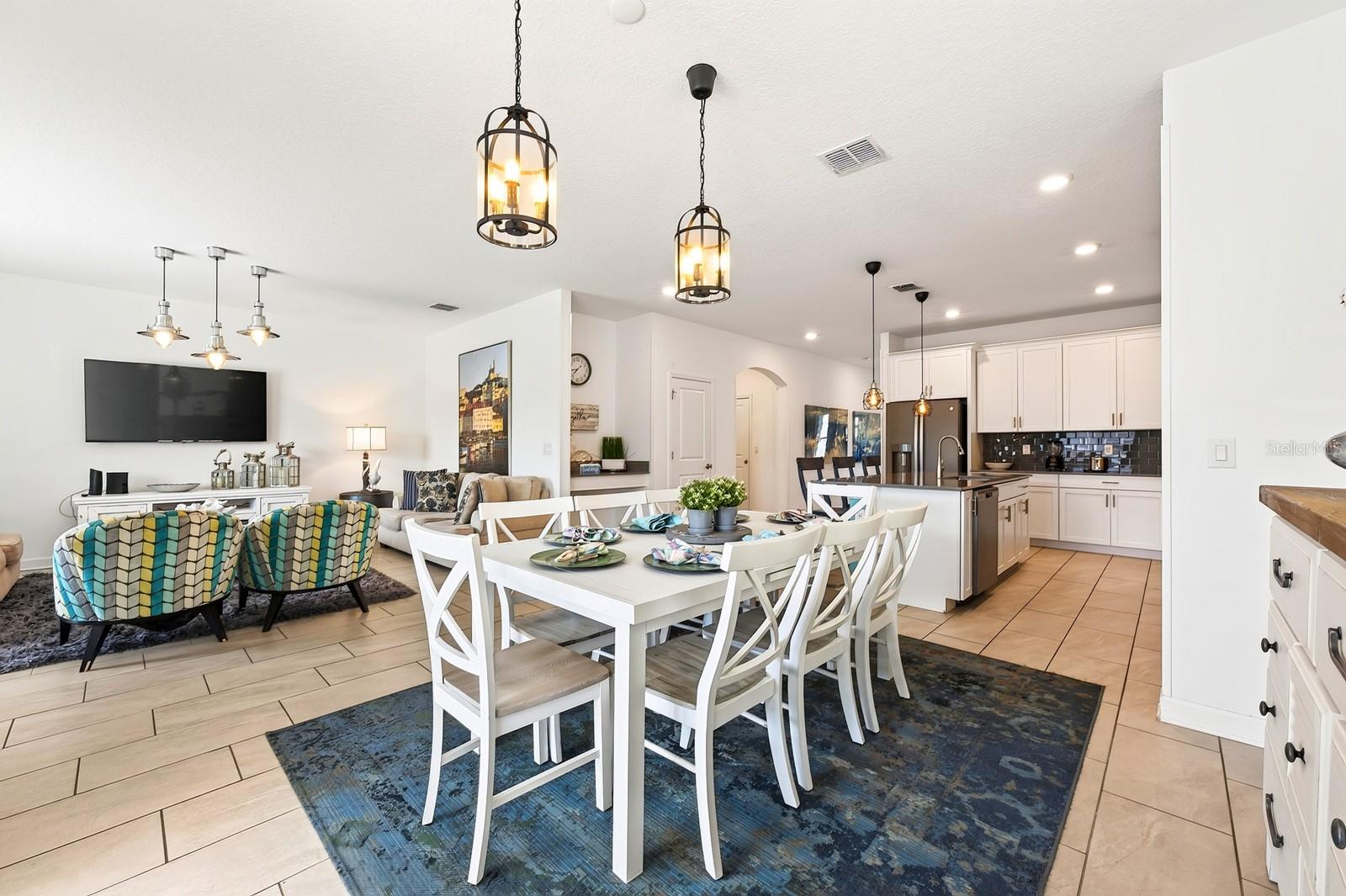 The adjacent Dining Area keeps everyone connected.