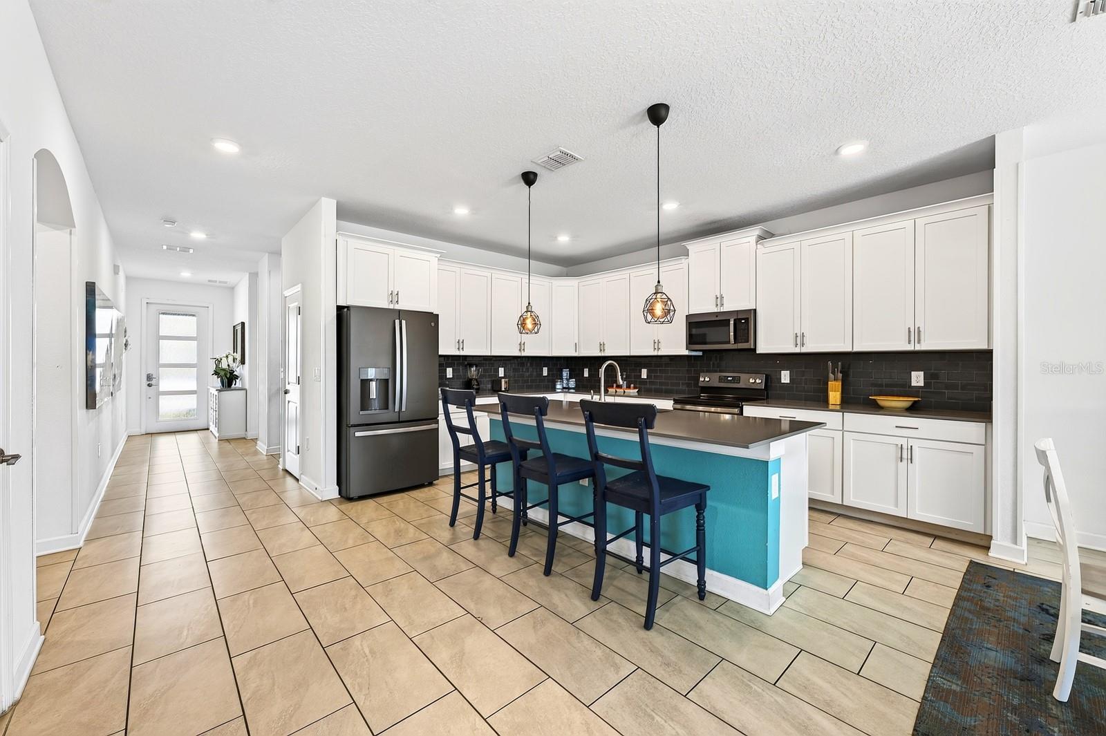 A generous center island offers extra prep space and room for counter-height seating.