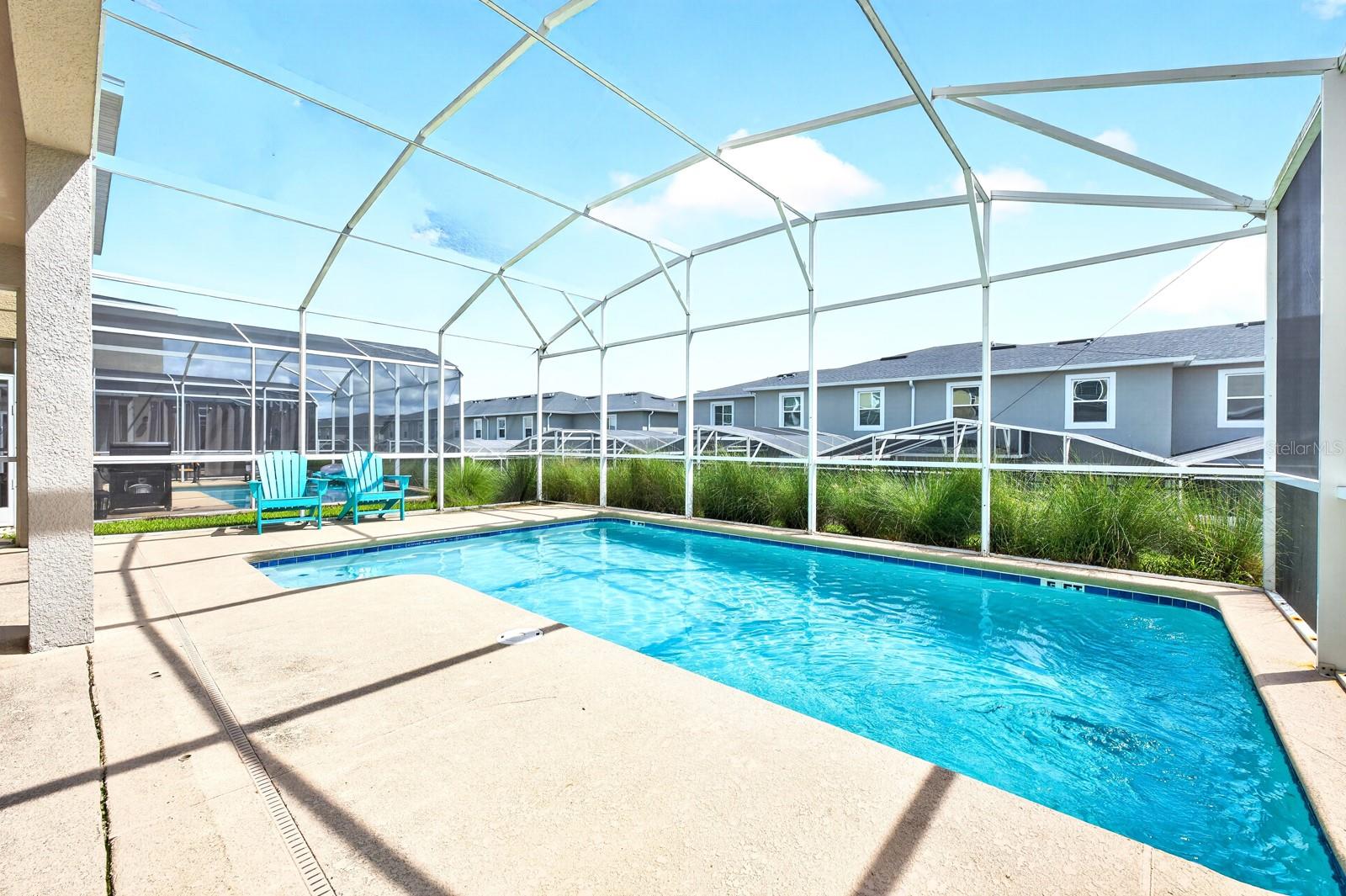 Outside, the PRIVATE POOL and covered patio under the SCREENED LANAI, create the perfect place to unwind after a day exploring Central Florida's attractions.