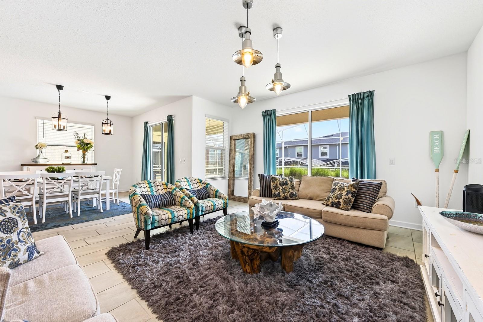 The expansive Living Room invites connection and comfort.
