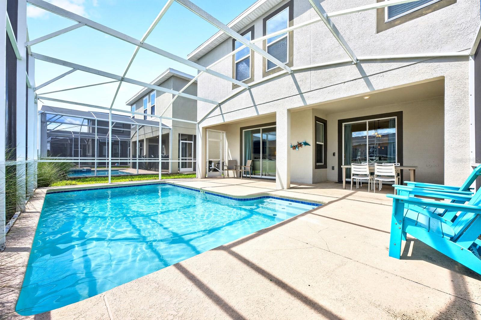 Sliding glass doors lead to your COVERED PATIO and PRIVATE POOL, all enclosed within a SCREENED LANAI.