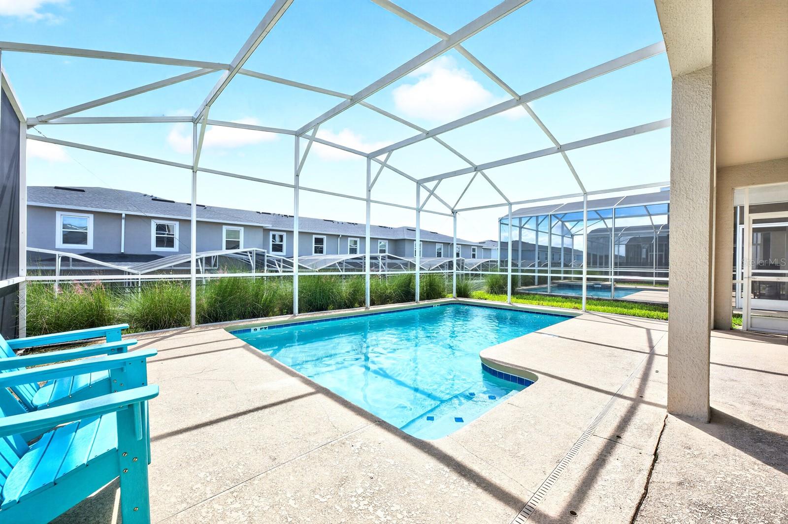 Outside, the PRIVATE POOL and covered patio under the SCREENED LANAI, create the perfect place to unwind after a day exploring Central Florida's attractions.