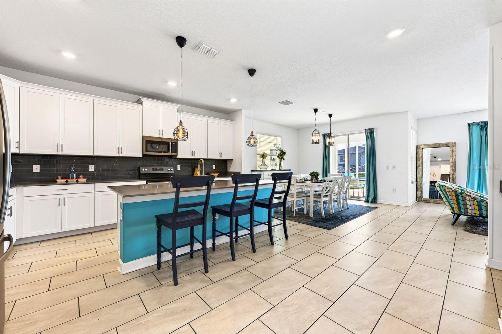 The main floor was designed for effortless gathering, with the Kitchen, Dining Area and Living Room flowing together in a bright OPEN CONCEPT layout.