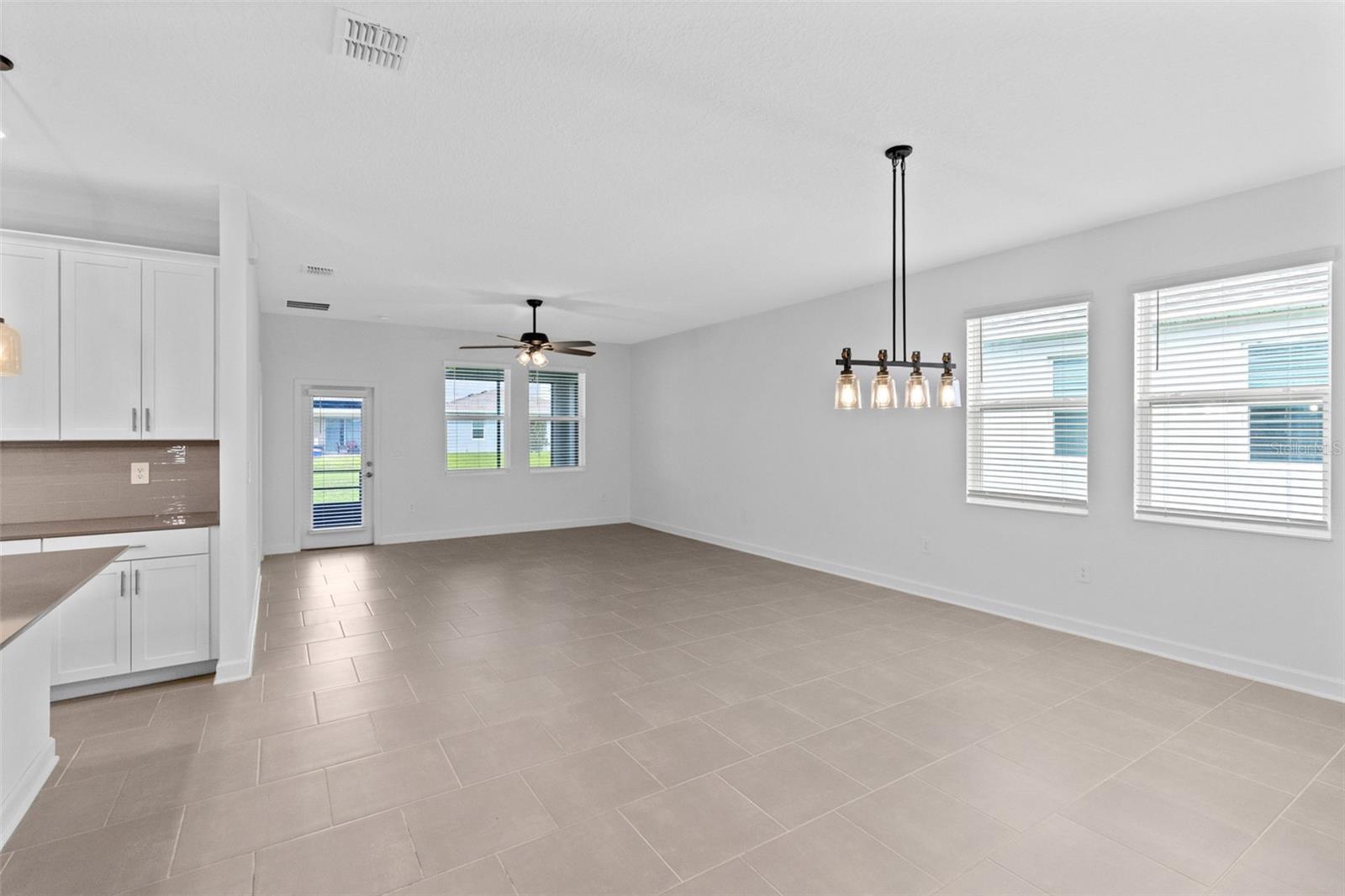 The open kitchen, dining and living spaces flow together beautifully, creating plenty of room for both everyday living and entertaining.