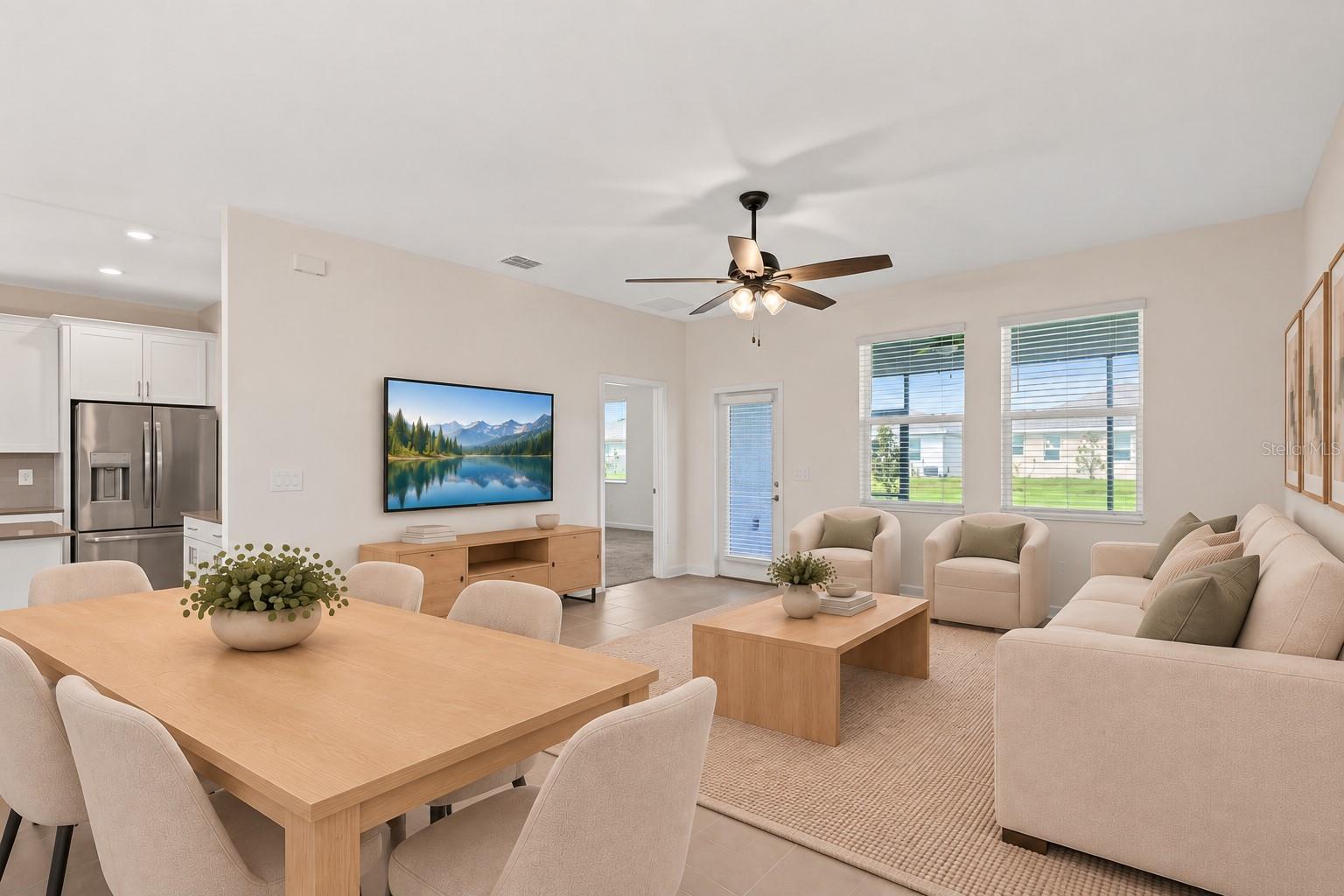 The dining and living spaces flow together beautifully, creating plenty of room for both everyday living and entertaining.