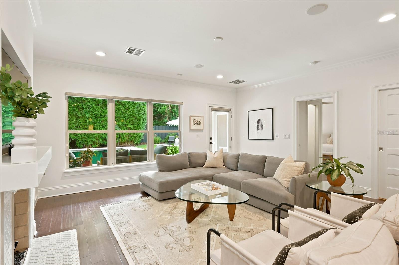 Family room overlooking verandah, pool and backyard