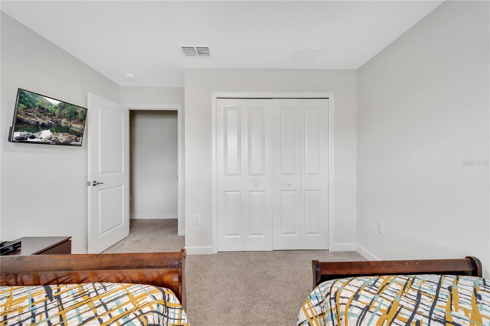 Bedroom 3 displaying closet and TV