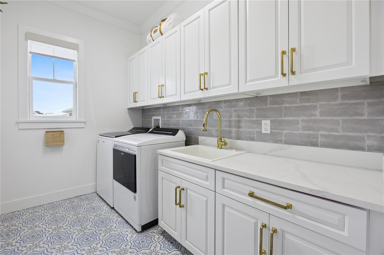First floor laundry with designer tile