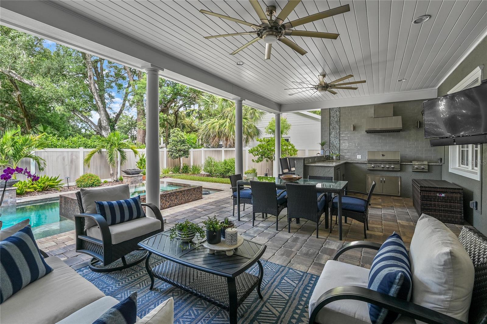 Ultimately, this outdoor living area is the favorite hub for enjoying Winter Park life under the tree canopy.