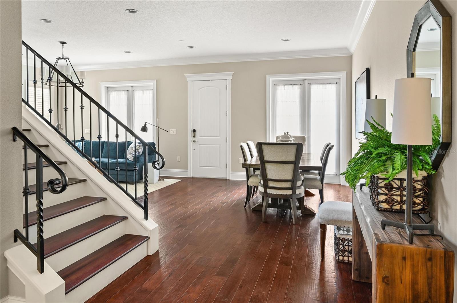 Hardwood floors and crown mouldings elevate the look of the interior while creating a cozy atmosphere.
