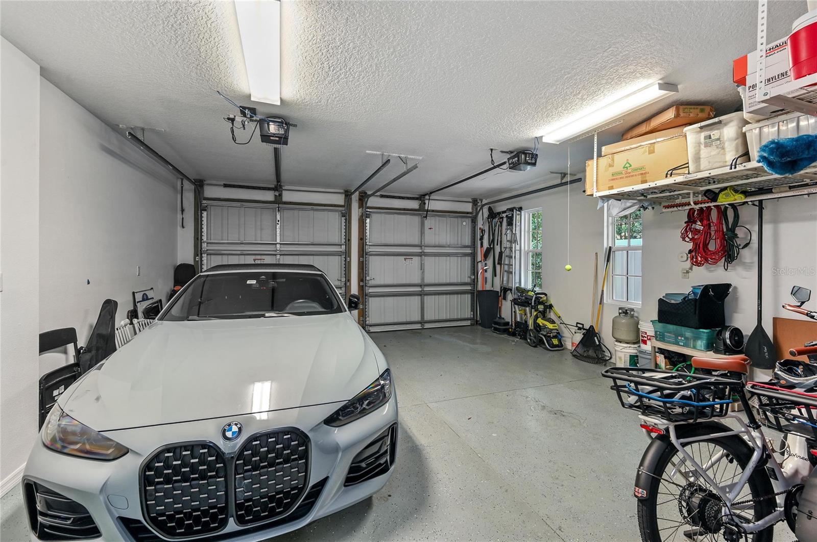 The two-car garage features heavy-duty, ceiling mounted storage.