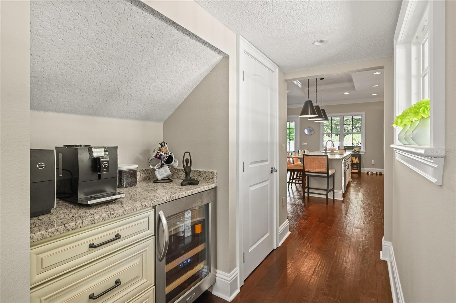 There is a coffee bar and wine fridge tucked in next to the kitchen.