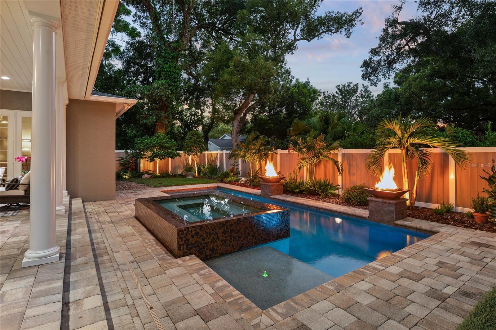 Landscape lighting creates a cozy, relaxing atmosphere at nightfall.