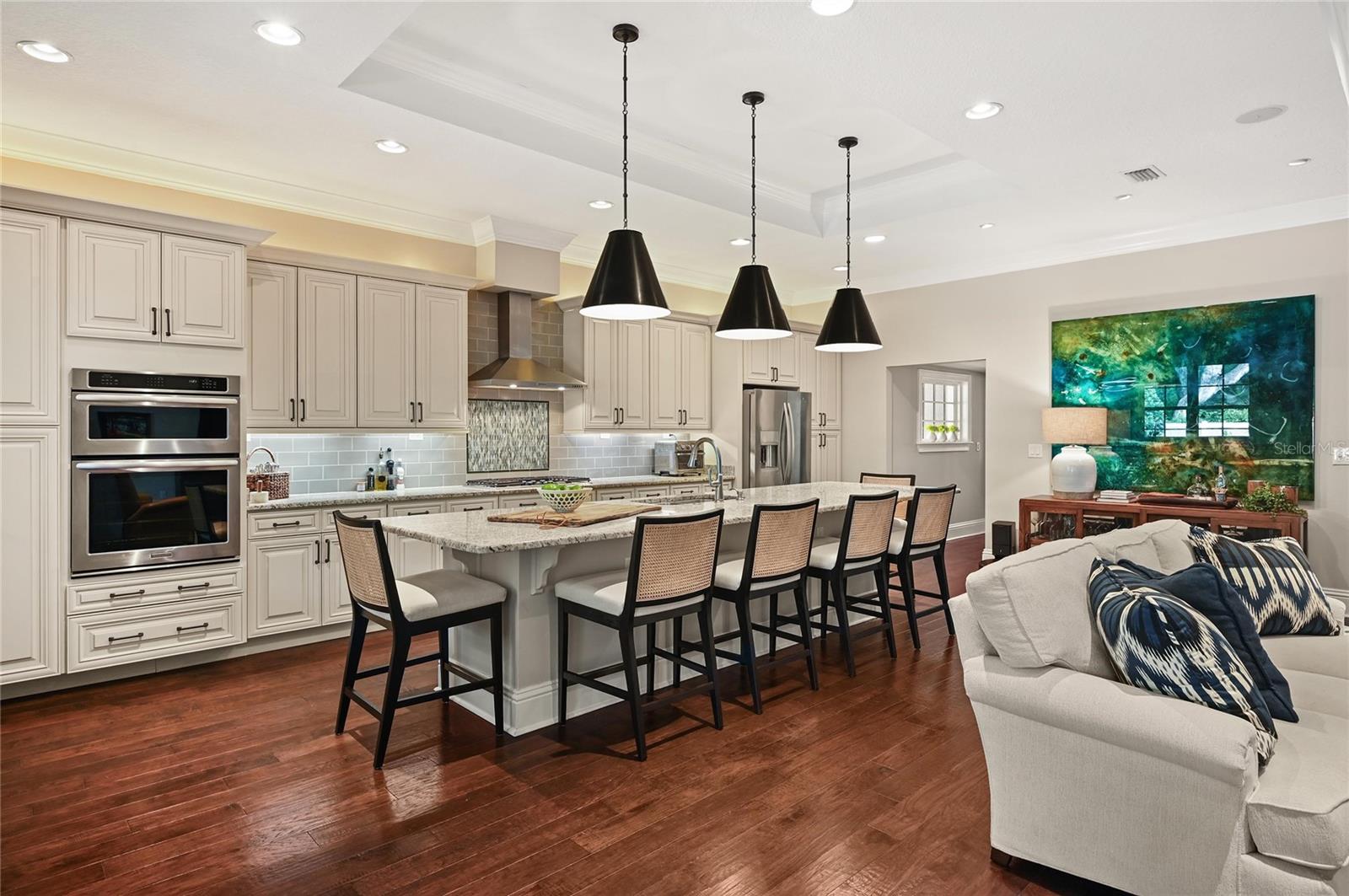 The stainless steel KitchenAid appliance package includes a gas cooktop and hood.