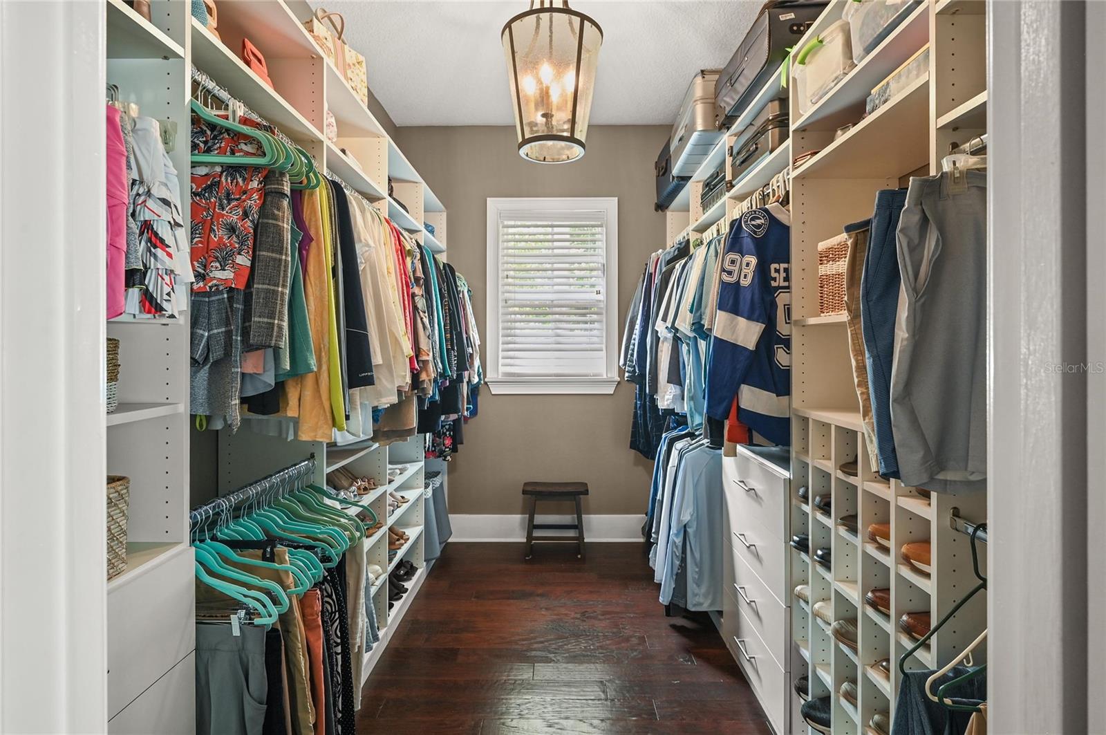 Another space made large by the natural light, high ceilings, and organizers, the primary closet checks all the boxes.
