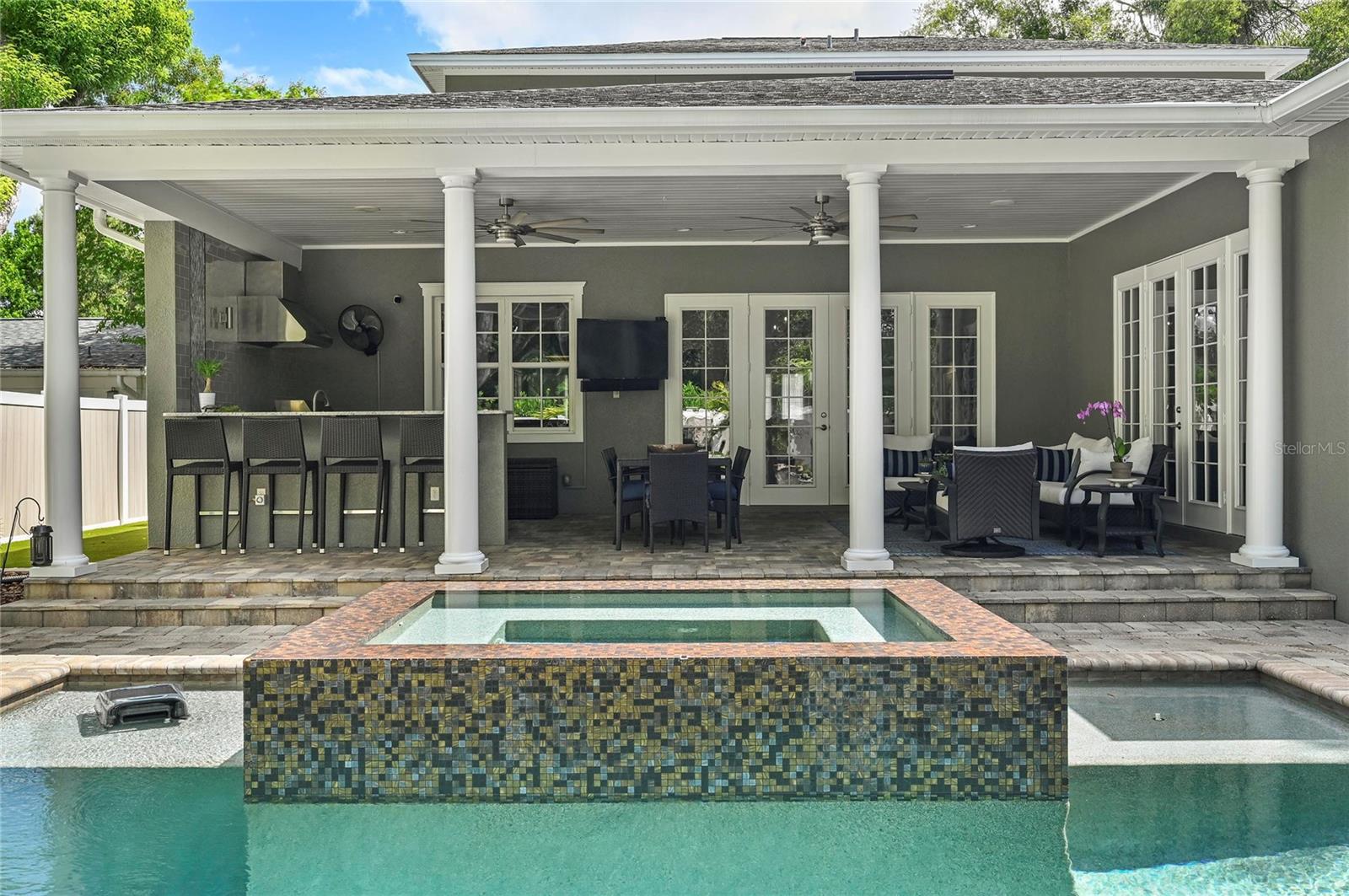 Accented by fire pits, the zen pool design makes lingering on the porch a delight.