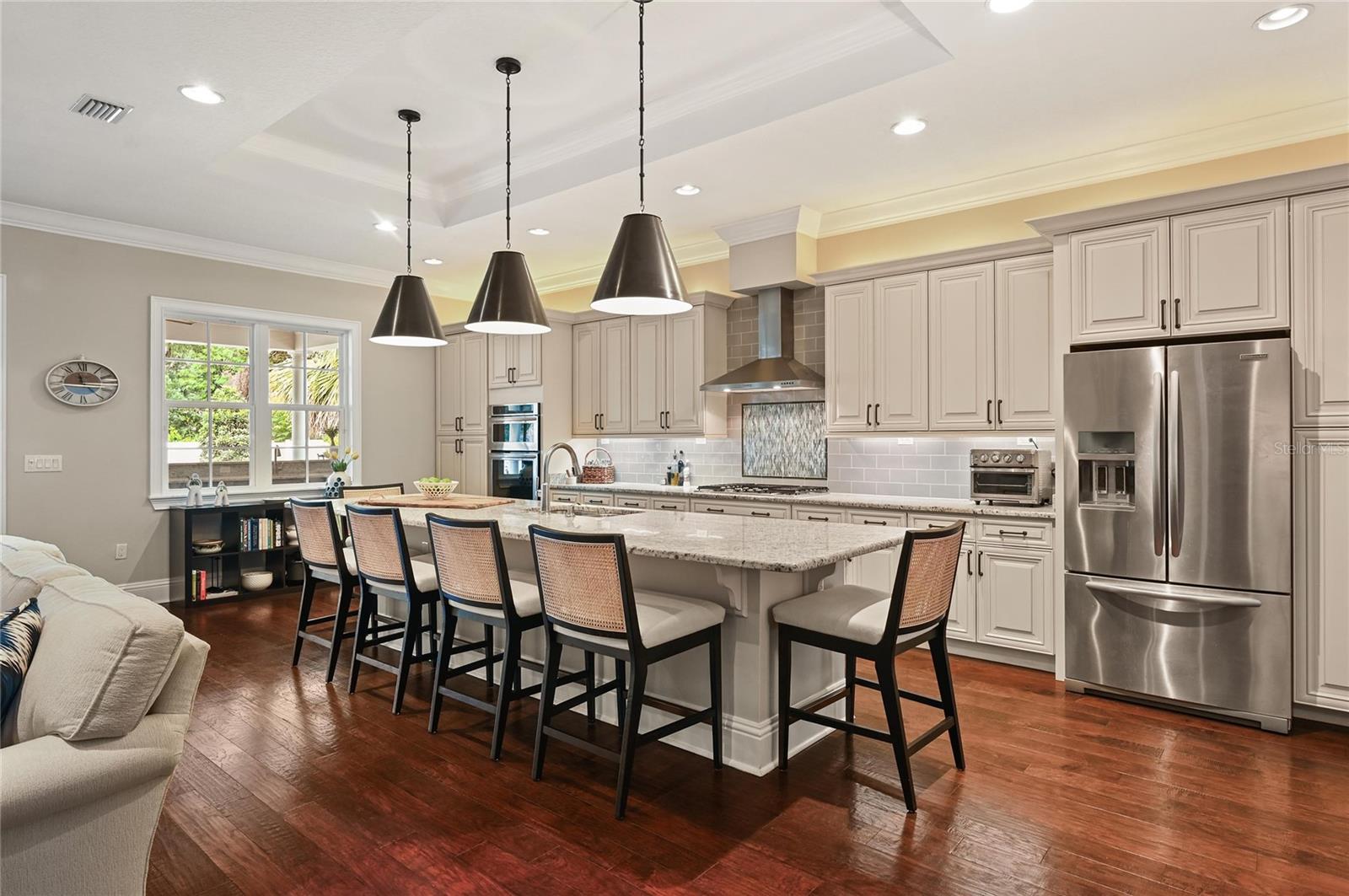 The center piece, an oversized granite island, makes this kitchen ideal for cooking, entertaining, as well as quick, casual meals.