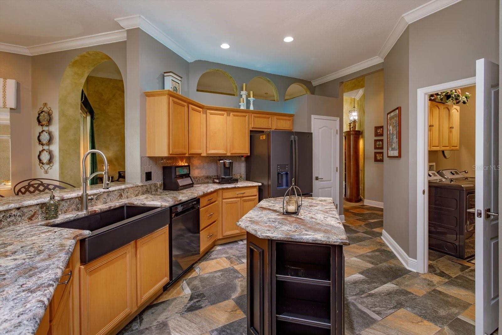 black granite apron sink and new frig & dishwasher