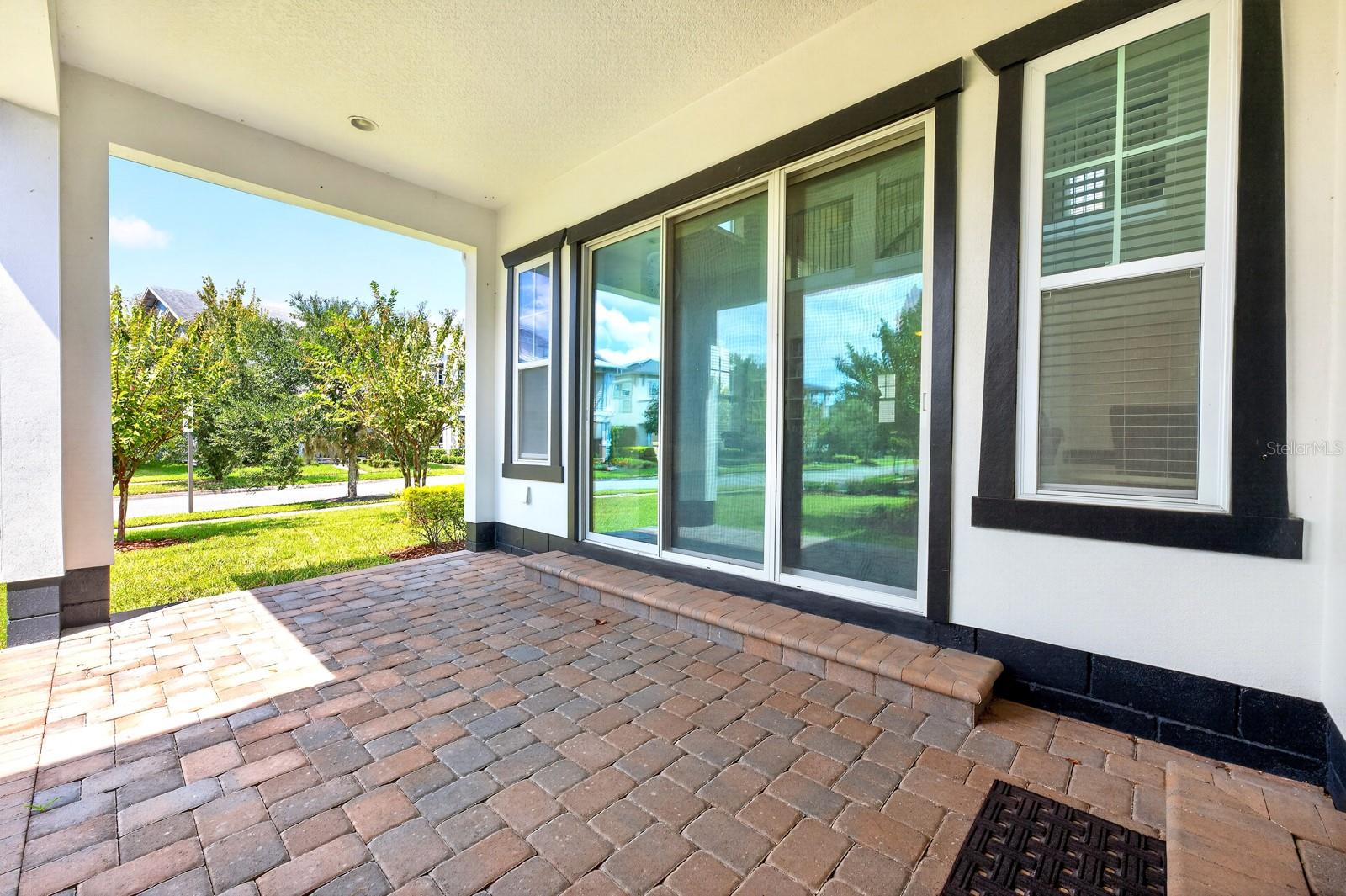 A wall of sliding glass doors creates the ultimate indoor/outdoor living.