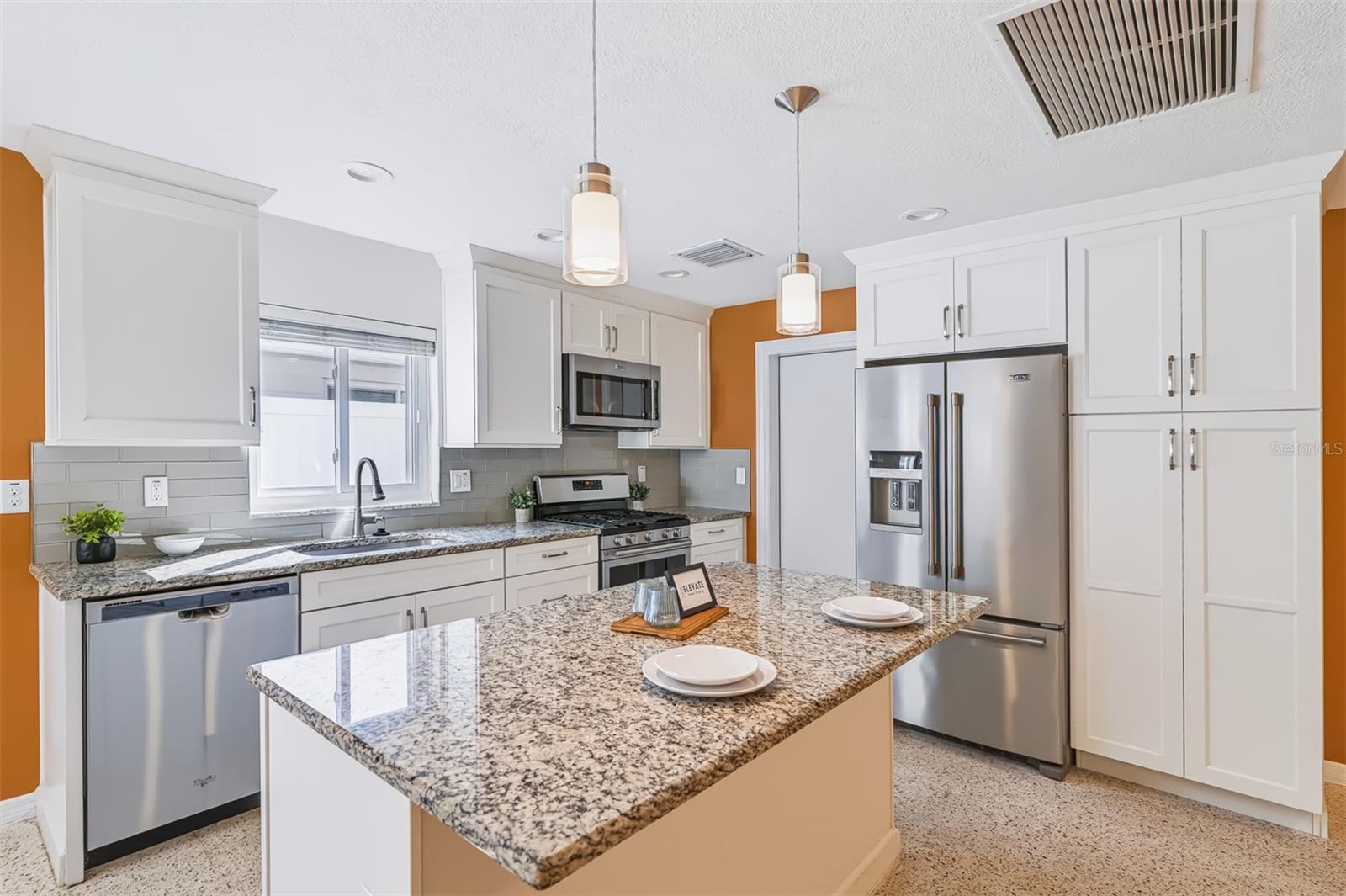 Kitchen with Granite Counters, Stainless-Steel Appliances & Soft-Close Drawers and Cabinets