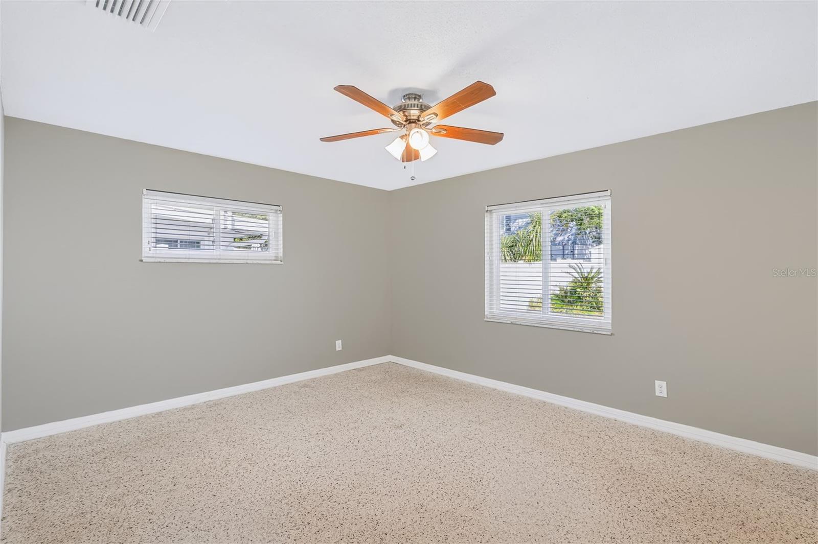 Primary Bedroom with Great Natural Light and Wonderful Terrazo Floors