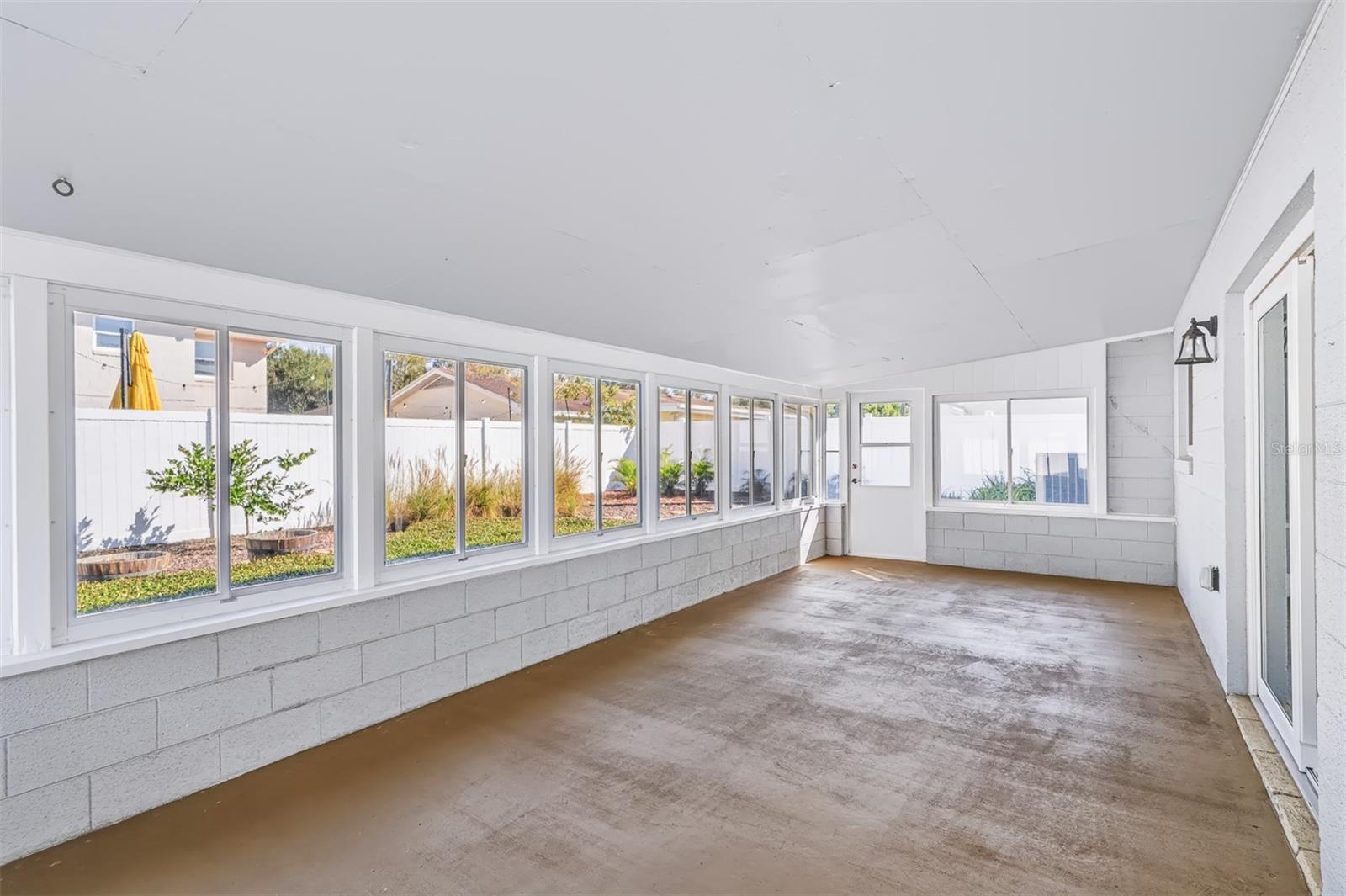 Enclosed Lanai with Windows That Wrap Around Entire Space
