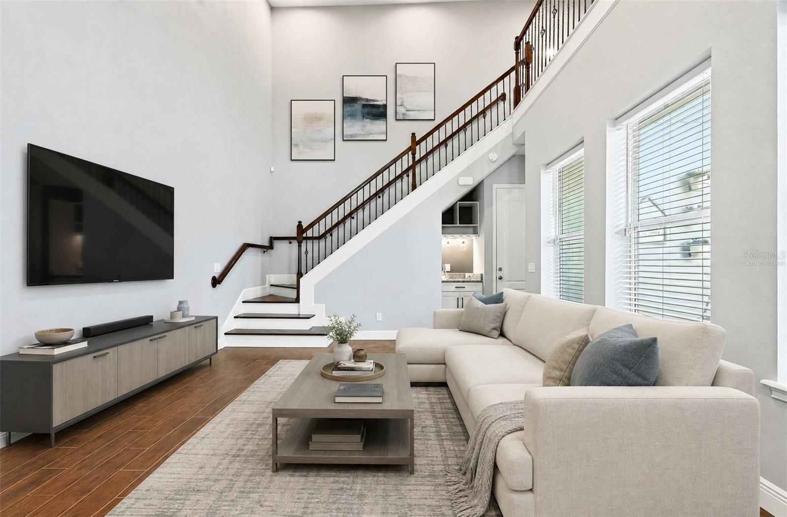 Light and bright two story living room. Virtually Staged.