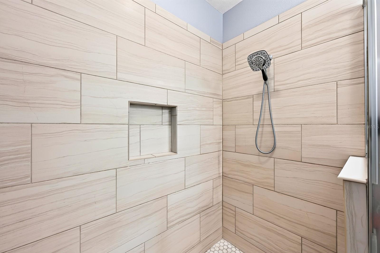 Tiled walk-in shower.