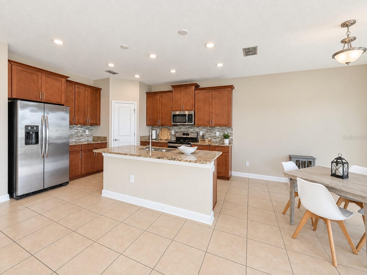 Open dining space connects naturally with the kitchen and main living areas.