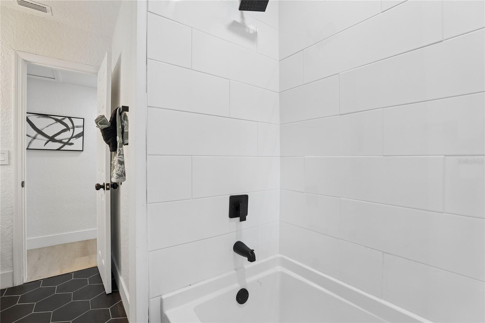 Stylish second bath with vessel sink and contemporary finishes