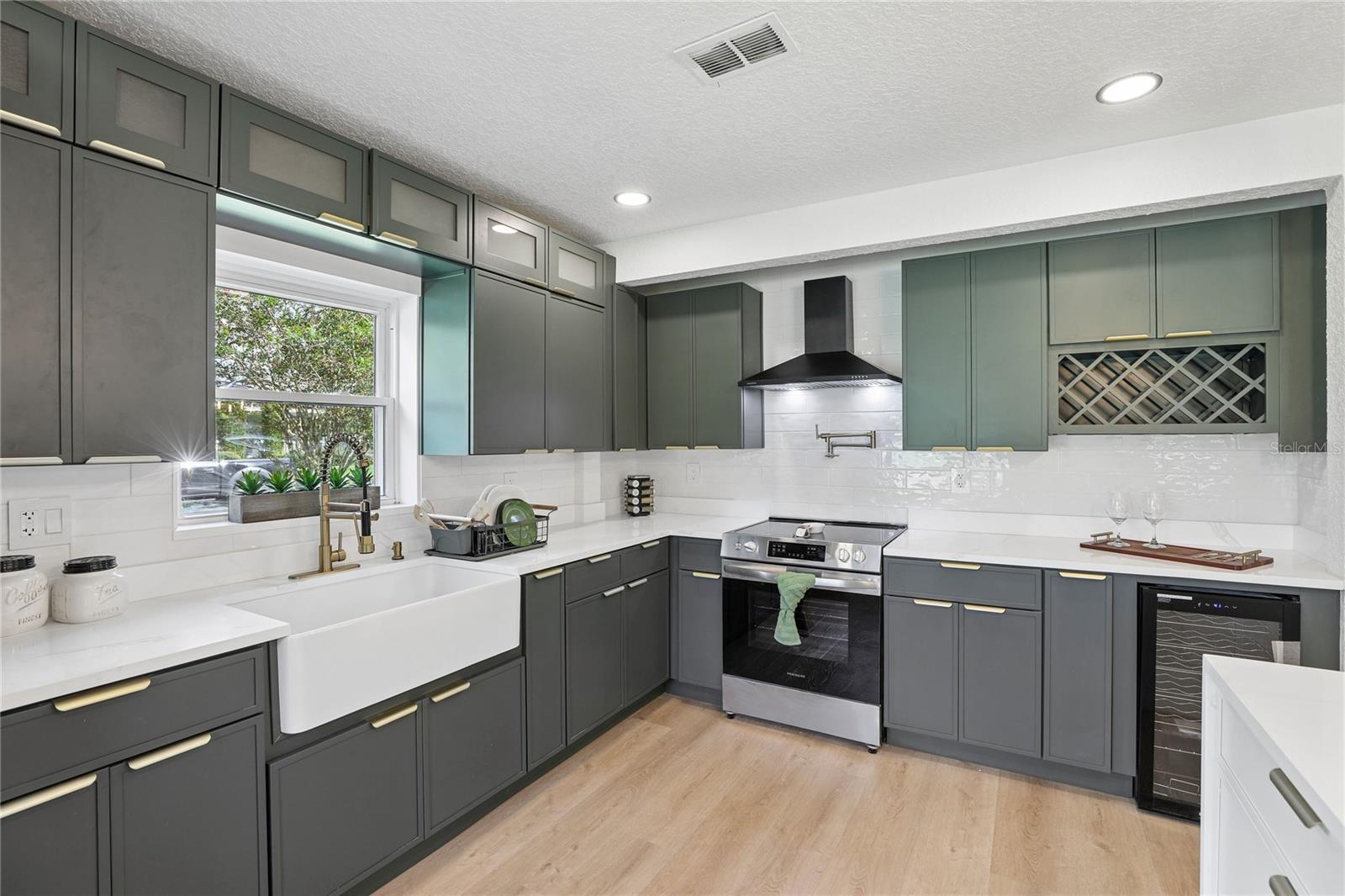 New cabinetry, quartz countertops, stylish hardware and statement finishes