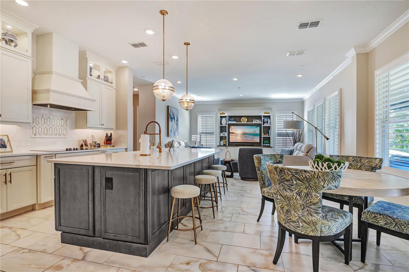 Open kitchen layout connects the island, breakfast nook and family room for everyday living and entertaining.