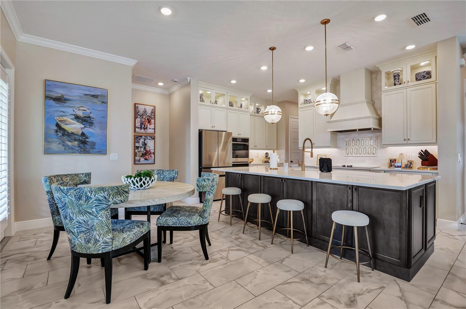 Breakfast nook and generous island seating provide multiple spaces for casual dining and gathering.
